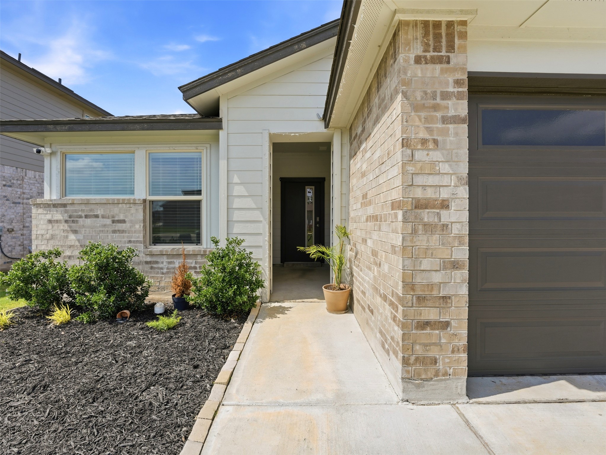 1024 Tipton Street Georgetown, TX 78633 - Photo 2 of 32 A well-maintained facade features light brick and horizontal siding, offering appealing curb appeal.