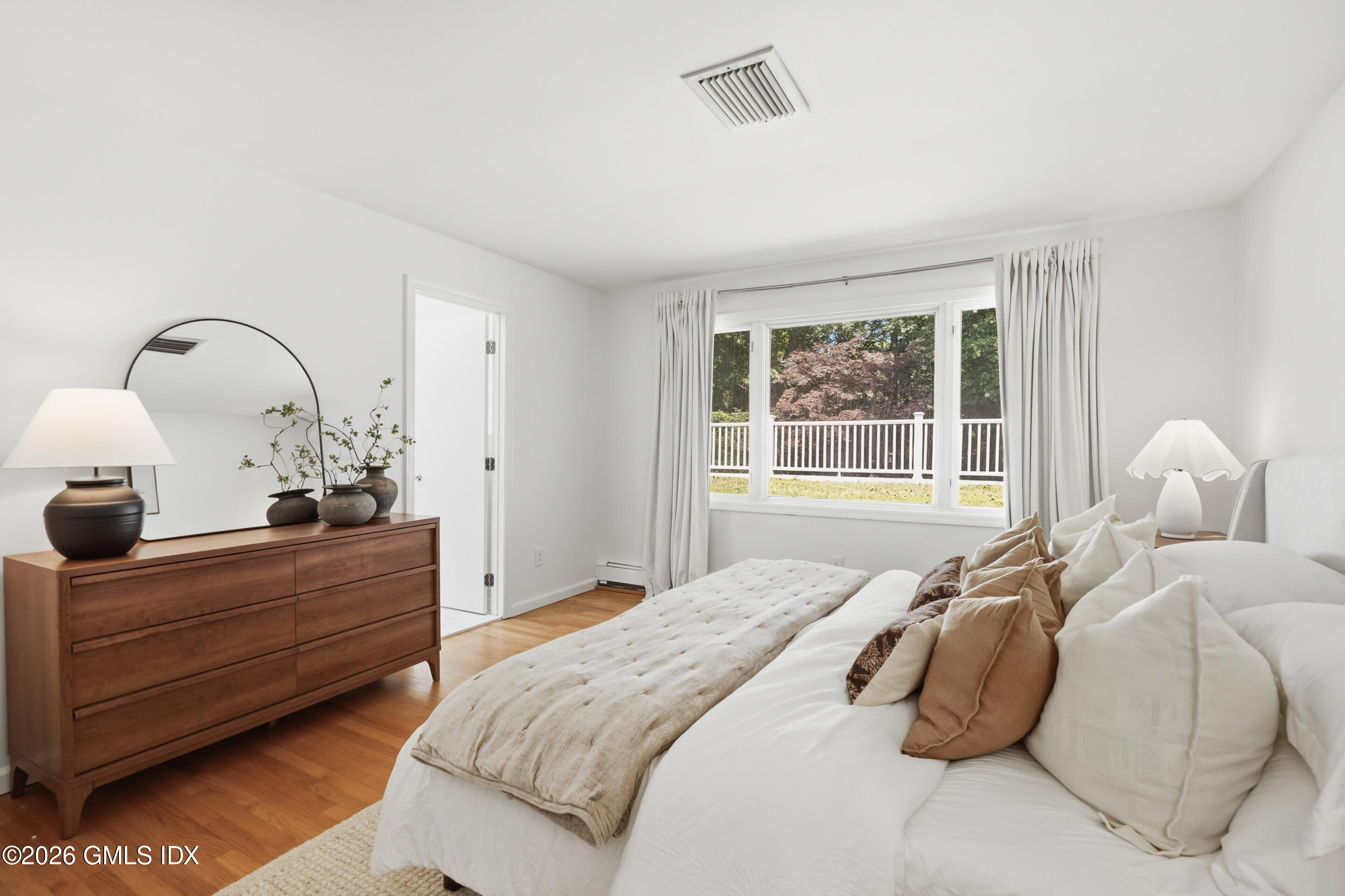 33 Sachem Road Greenwich, CT 06830 - Photo 11 of 35 a bed room with bed and a window