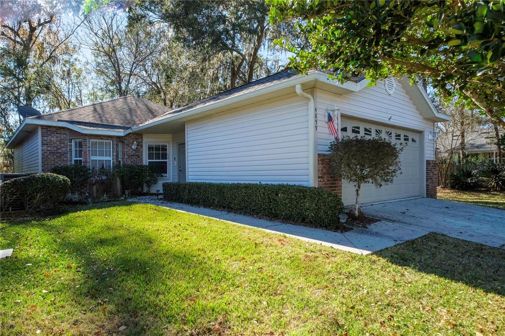 4859 Northwest 77 Road Gainesville, FL 32653 - Photo 1 of 1 a view of a house with a yard and plants