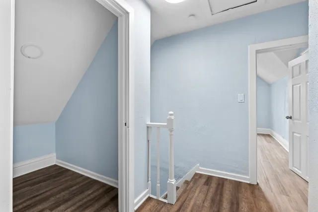 a view of room with wooden floor