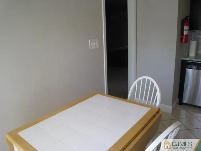 a bedroom with a bed and a television