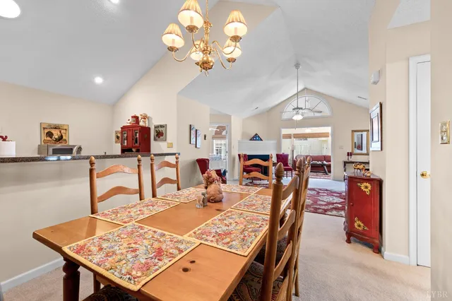 a view of a dining room and hall with furniture
