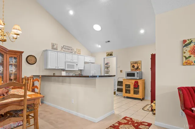a kitchen with stainless steel appliances wooden floor and center island