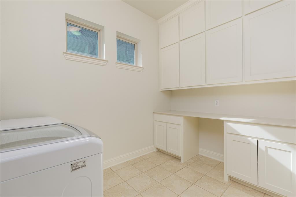 2205 State Boulevard McKinney, TX 75071 - Photo 23 of 40 Utility room with newly installed cabinets and countertop.