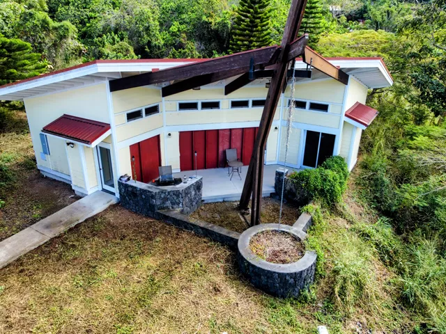 a view of a backyard with plants and a patio