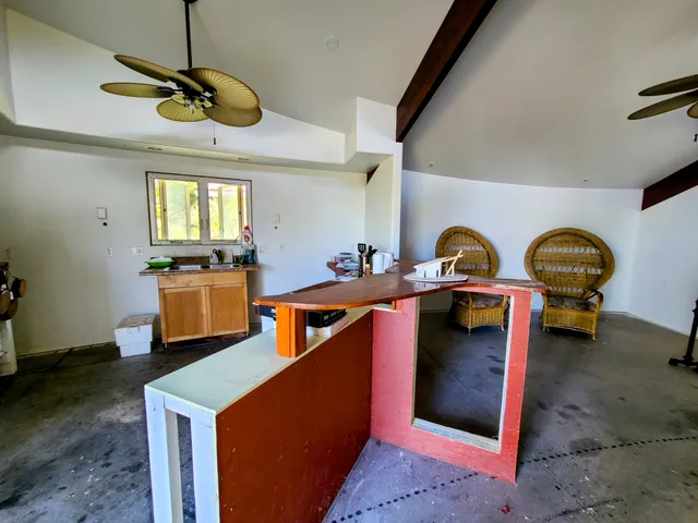 a kitchen with stainless steel appliances kitchen island granite countertop a stove a sink and a microwave