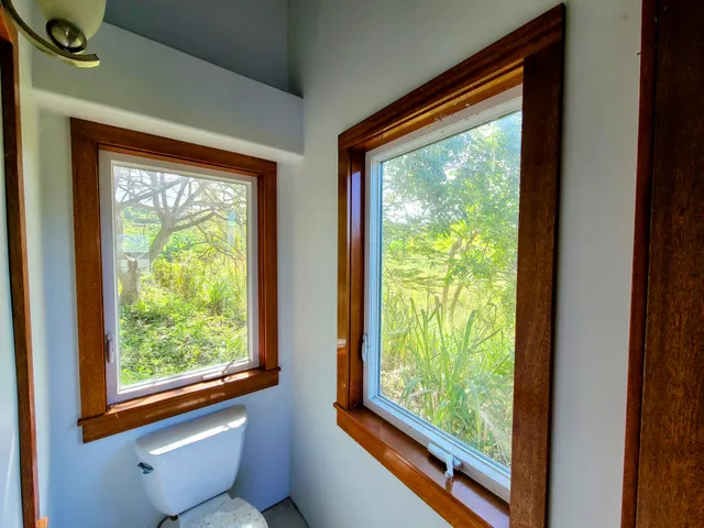 a view of a room that has a bed and a window