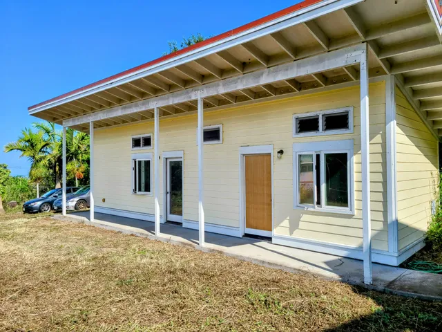 a view of a house with wooden floor and a chair