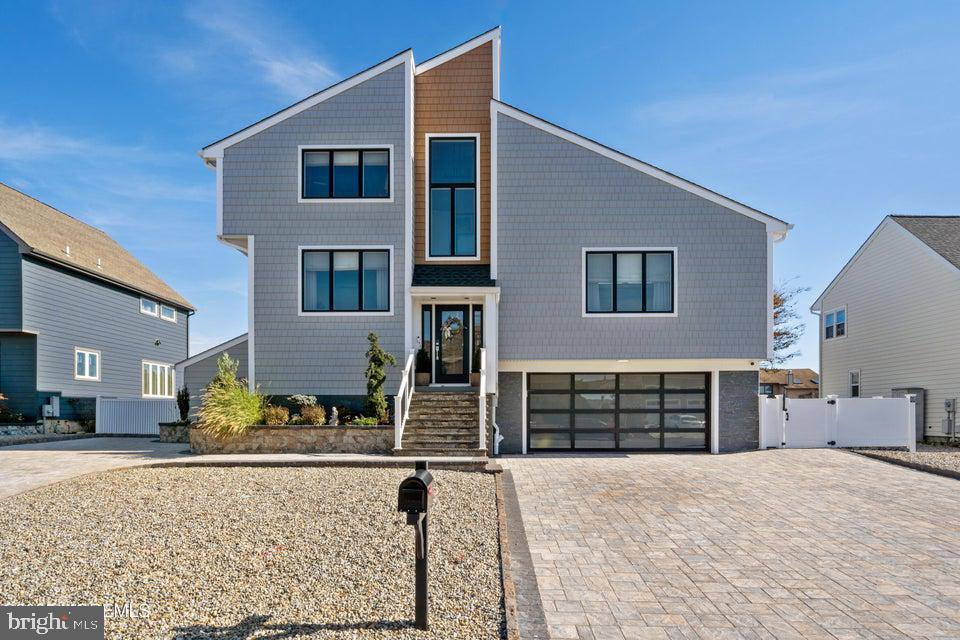 1210 Skimmer Court Forked River, NJ 08731 - Photo 1 of 66 a front view of a house with a yard