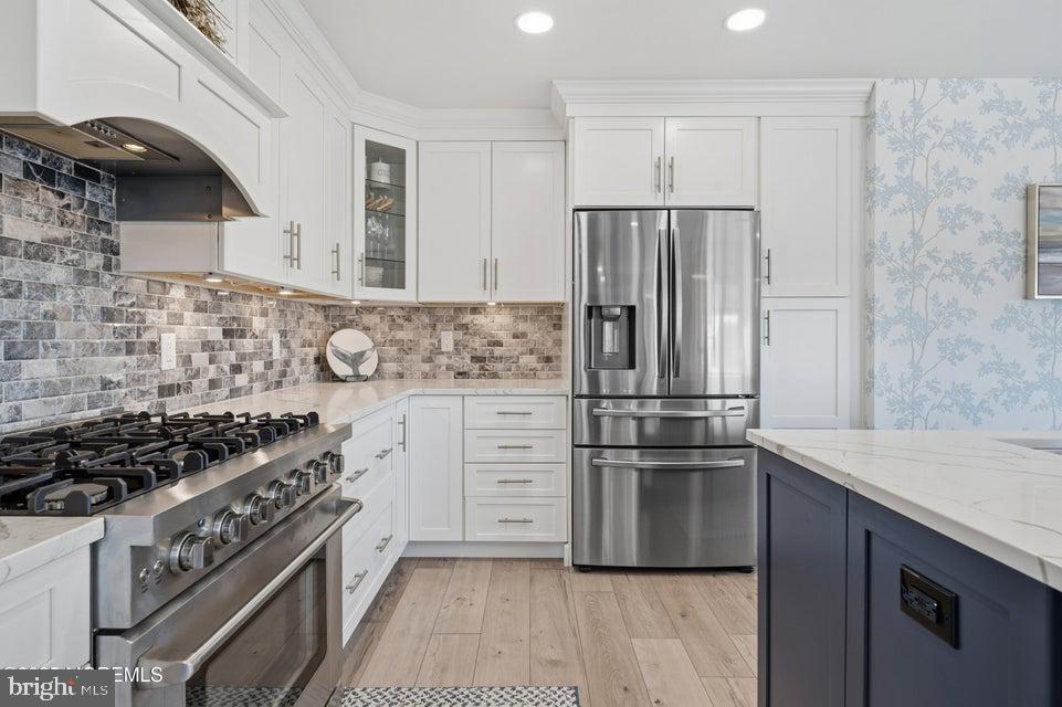 1210 Skimmer Court Forked River, NJ 08731 - Photo 12 of 66 a kitchen with granite countertop a refrigerator and a stove