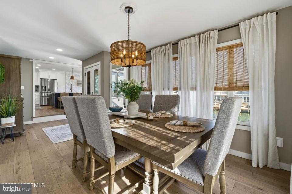 1210 Skimmer Court Forked River, NJ 08731 - Photo 18 of 66 a view of a dining room with furniture window and wooden floor