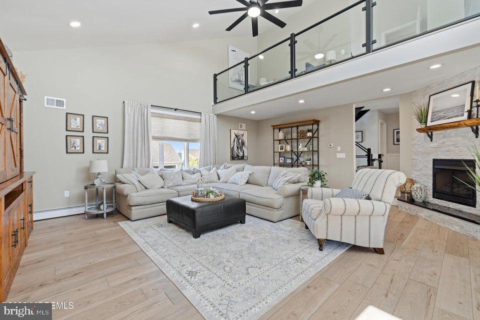 1210 Skimmer Court Forked River, NJ 08731 - Photo 21 of 66 a living room with furniture and a fireplace