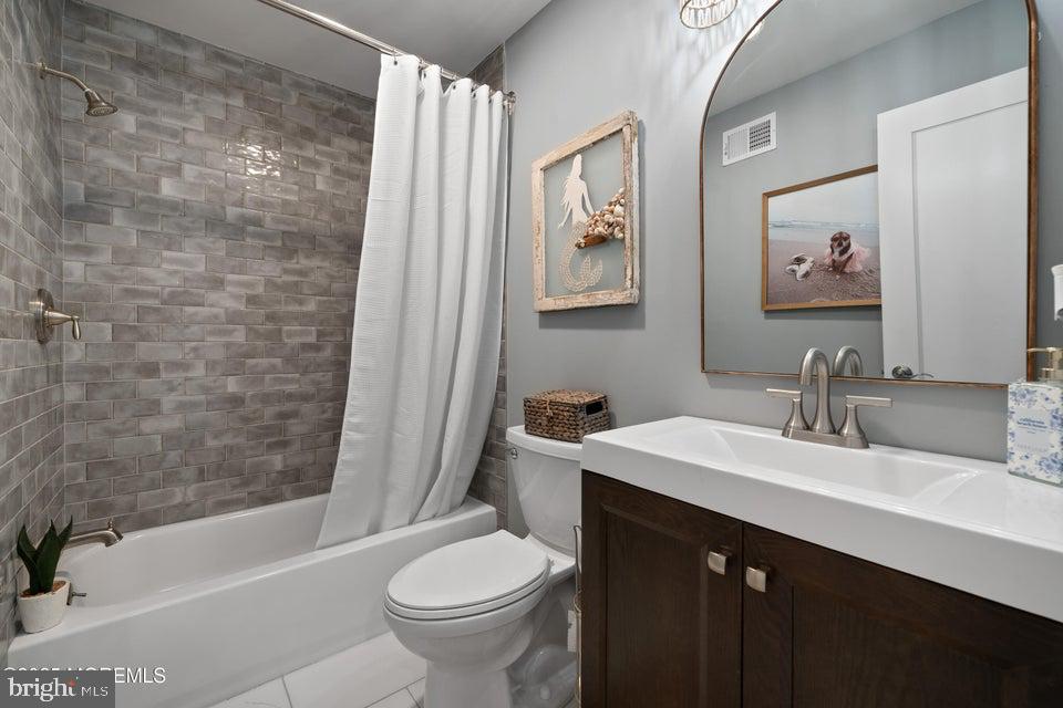 1210 Skimmer Court Forked River, NJ 08731 - Photo 27 of 66 a bathroom with a sink a toilet and a bathtub