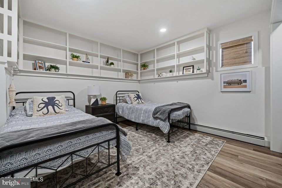 1210 Skimmer Court Forked River, NJ 08731 - Photo 40 of 66 a bedroom with furniture and wooden floor
