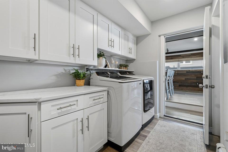 1210 Skimmer Court Forked River, NJ 08731 - Photo 44 of 66 a kitchen with white cabinets and white appliances