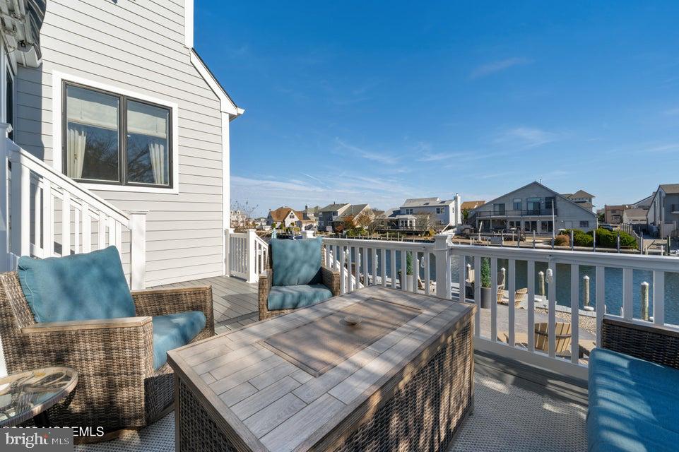 1210 Skimmer Court Forked River, NJ 08731 - Photo 58 of 66 a view of a balcony with two chairs and a table