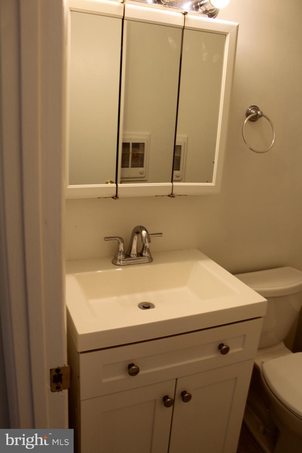 178 Elephant Road, Unit A6 Dublin, PA 18917 - Photo 15 of 19 a bathroom with a sink and a mirror