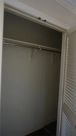 a lobby with entryway and a rug