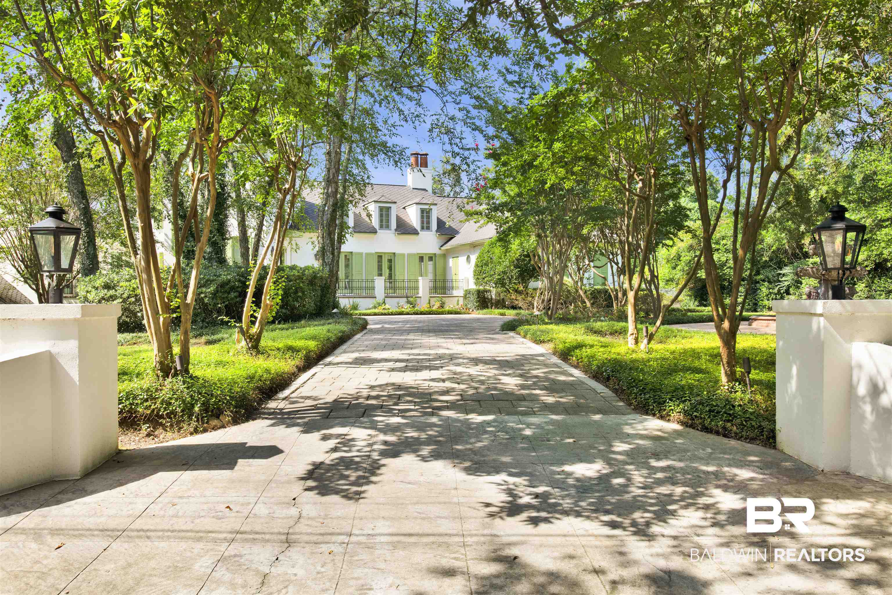 3816 Austill Lane Mobile, AL 36608 - Photo 5 of 80 View of front facade with a chimney, driveway, and stucco siding