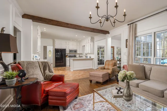 a kitchen with stainless steel appliances a refrigerator sink and microwave