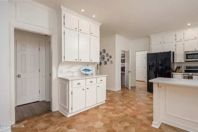 a view of a bedroom with wooden floor and entryway