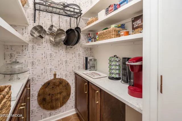 a view of a dining room with furniture and window