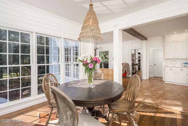 a view of a livingroom with entryway and a window