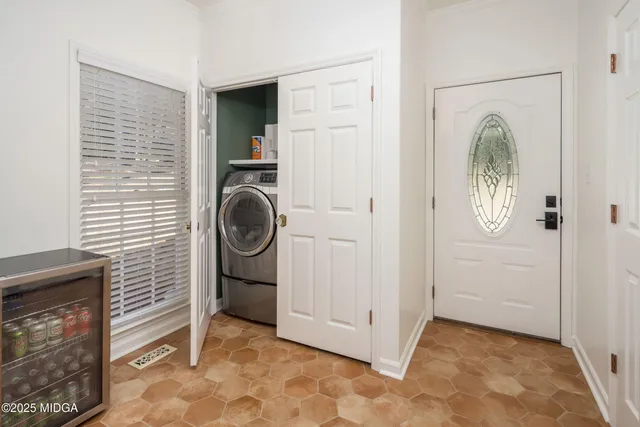 a bedroom with bed and tv