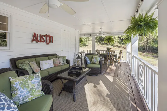 a view of a chairs and table in the balcony