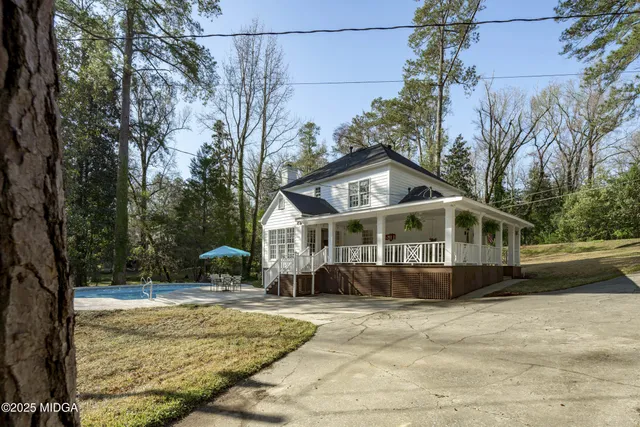 a view of a swimming pool with sitting area
