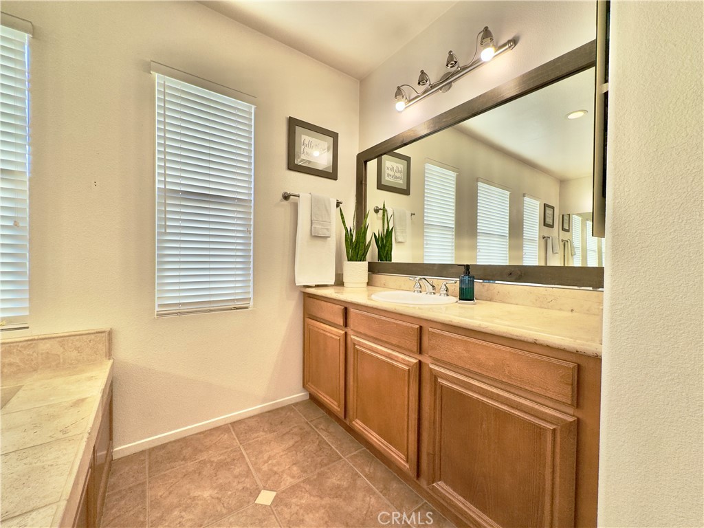 11265 Runyan Road Beaumont, CA 92223 - Photo 87 of 138 Grand Primary Bedroom Suite Bathroom with large soaking tub, separate vanities, water closet, and large walk-in closet and shower.