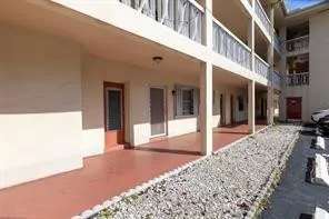 a view of a building with a patio