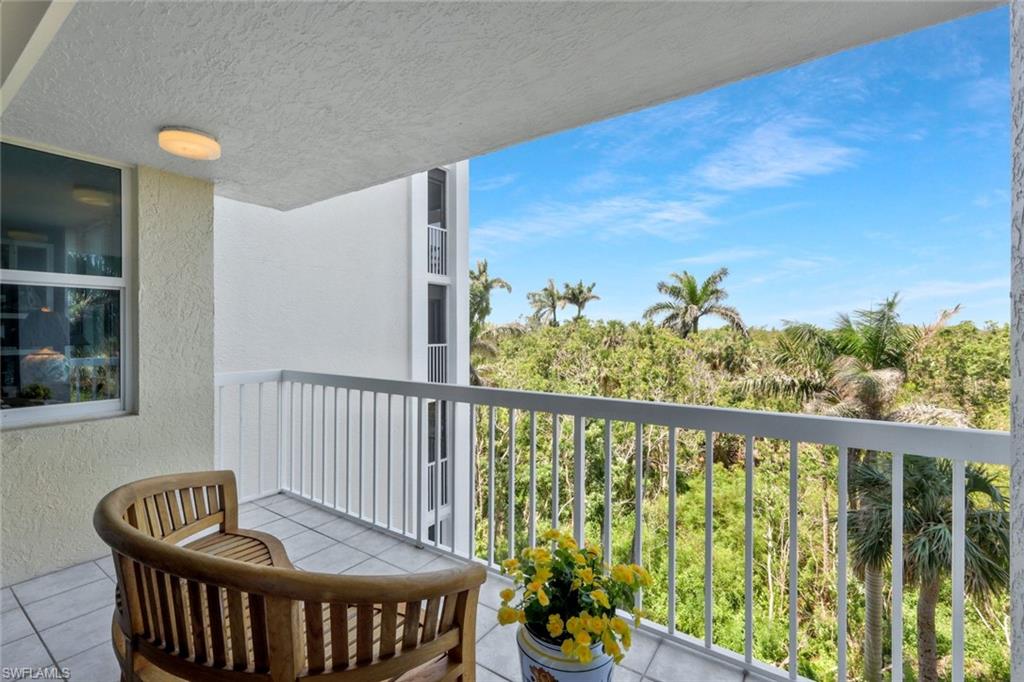 6573 Marissa Loop, Unit 303 Naples, FL 34108 - Photo 21 of 31 a view of a balcony with furniture
