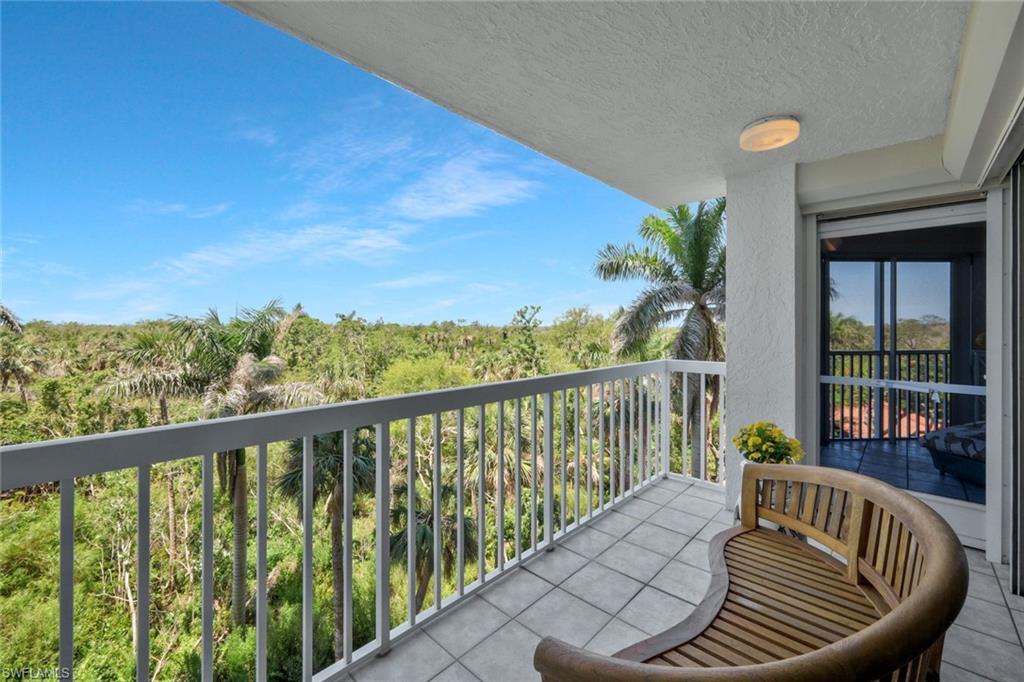 6573 Marissa Loop, Unit 303 Naples, FL 34108 - Photo 22 of 31 a view of balcony with wooden floor and seating space