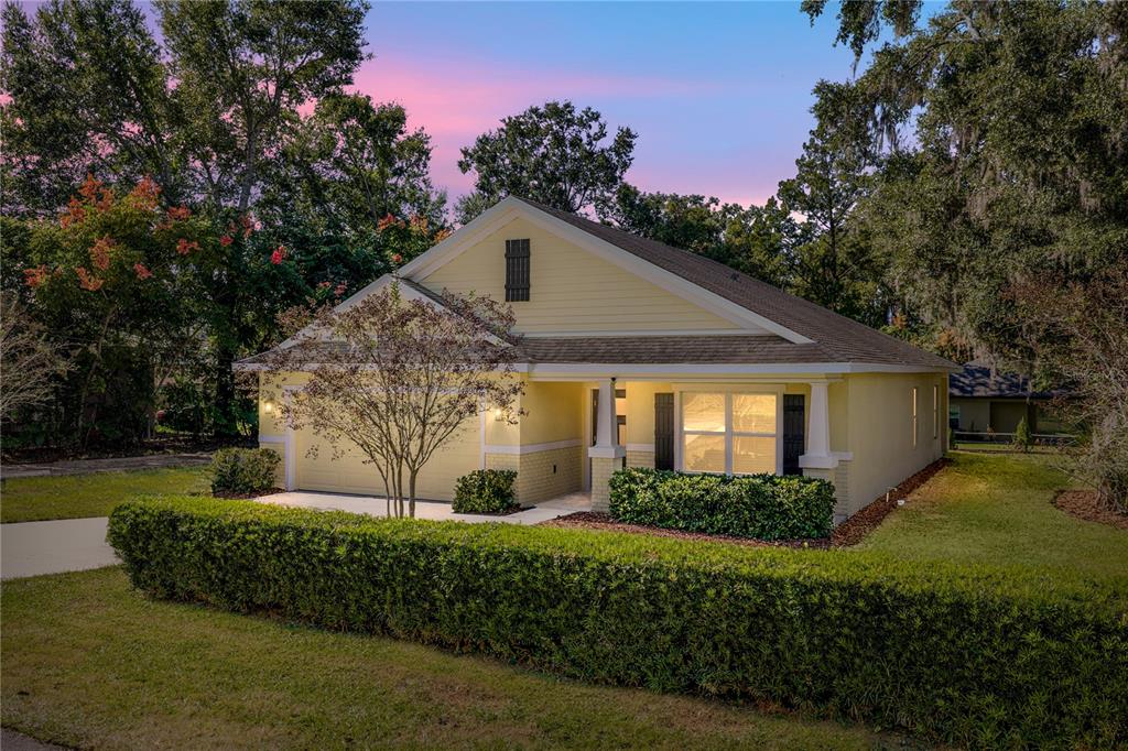 13907 9th Street Dade City, FL 33525 - Photo 1 of 43 a front view of a house with a yard