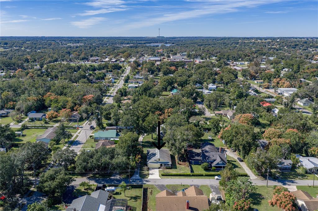 13907 9th Street Dade City, FL 33525 - Photo 2 of 43 an aerial view of a city with lots of residential buildings