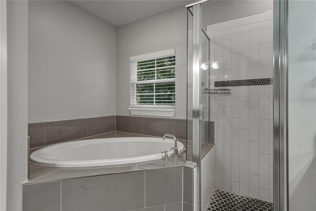 13907 9th Street Dade City, FL 33525 - Photo 23 of 43 a white bath tub sitting next to a window