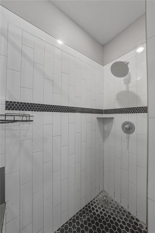 13907 9th Street Dade City, FL 33525 - Photo 25 of 43 a bathroom with a shower