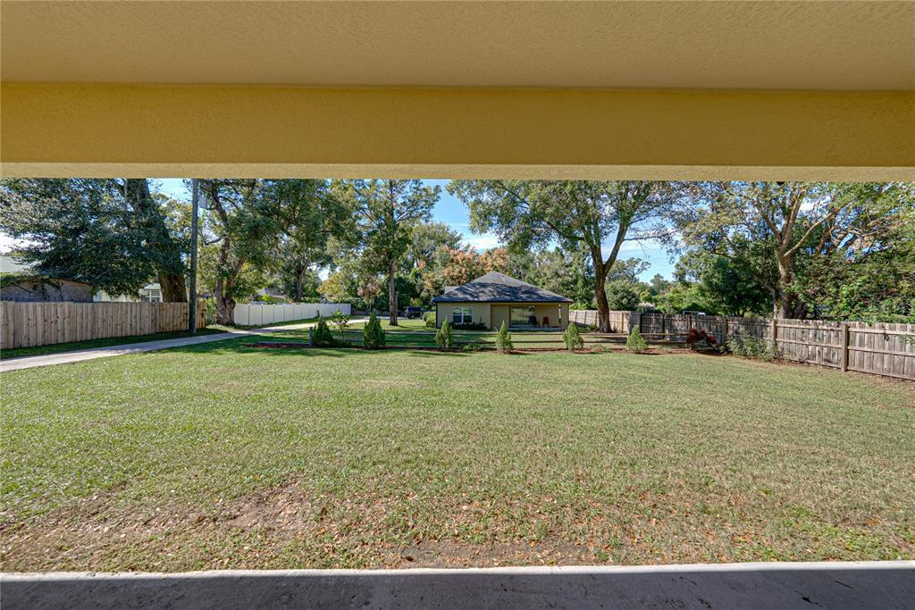 13907 9th Street Dade City, FL 33525 - Photo 35 of 43 a view of a yard with a slide