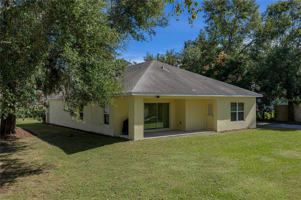 13907 9th Street Dade City, FL 33525 - Photo 39 of 43 a front view of house with yard and trees