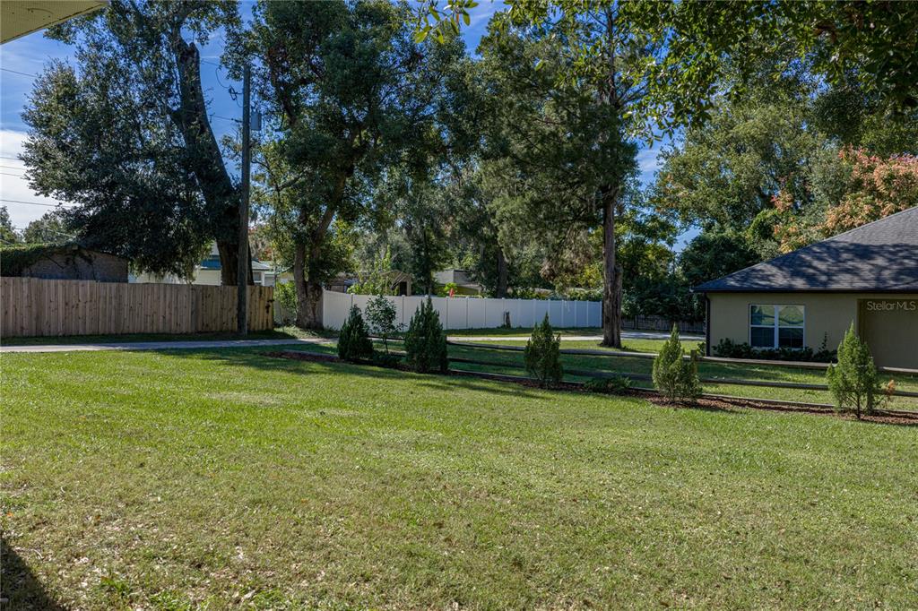 13907 9th Street Dade City, FL 33525 - Photo 40 of 43 a view of a backyard with furniture and a fire pit