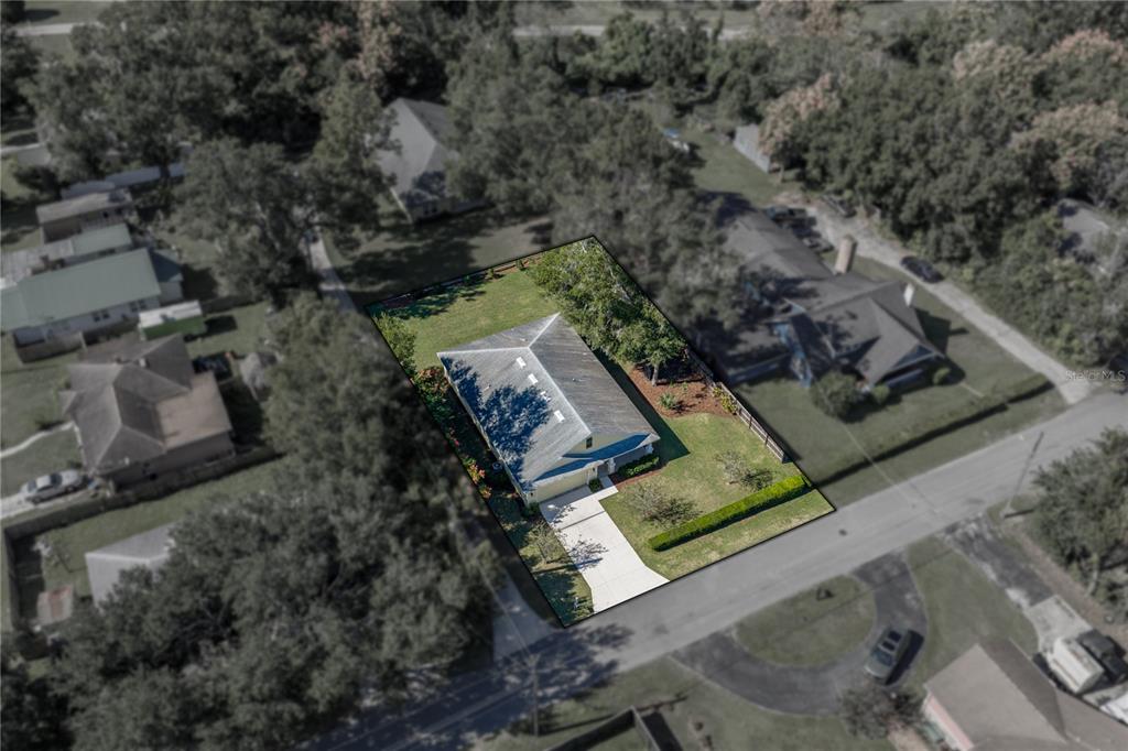 13907 9th Street Dade City, FL 33525 - Photo 4 of 43 an aerial view of house with yard
