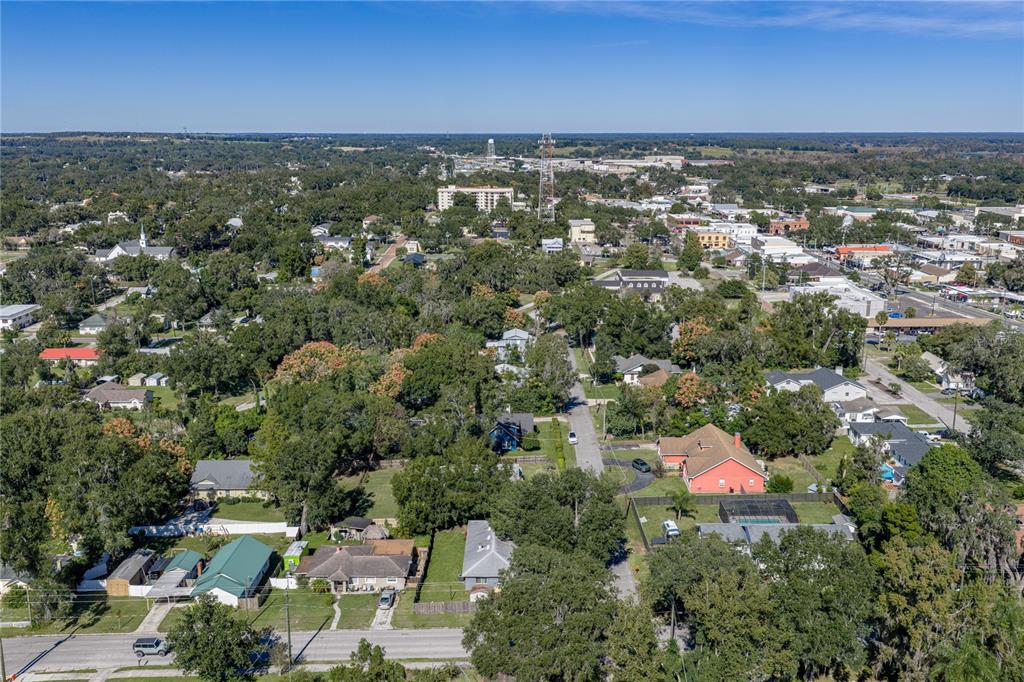 13907 9th Street Dade City, FL 33525 - Photo 43 of 43 an aerial view of residential houses with outdoor space and trees