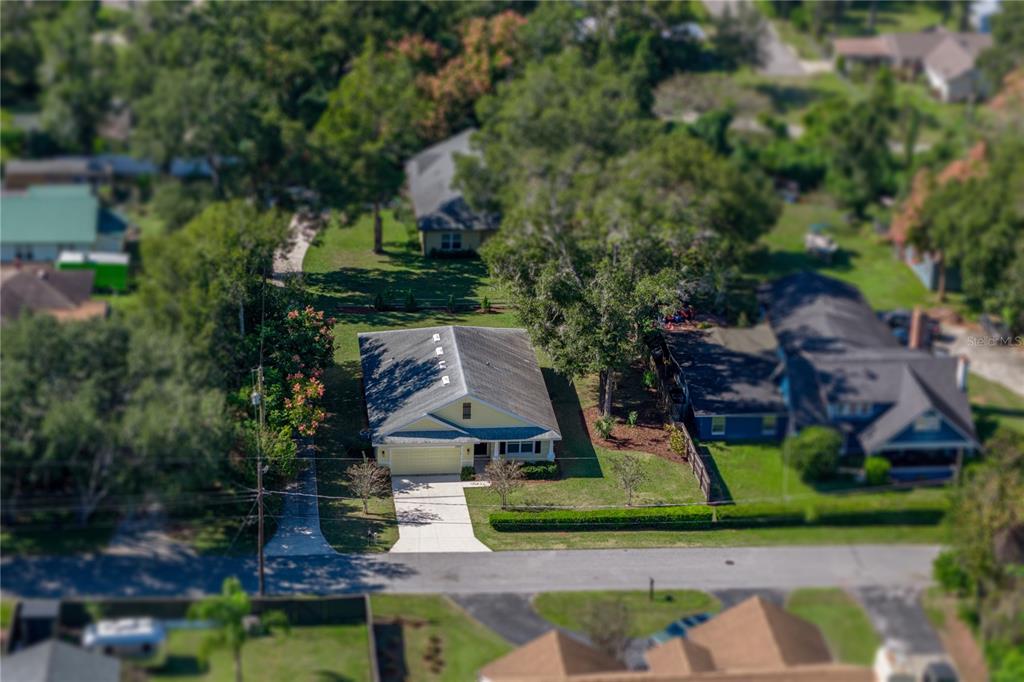 13907 9th Street Dade City, FL 33525 - Photo 5 of 43 an aerial view of a house