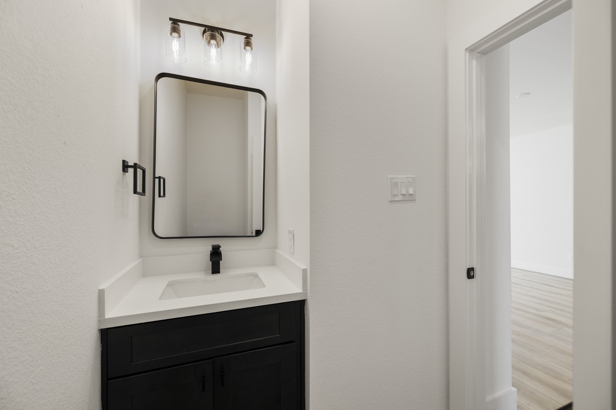 6326 Del Rio Street Houston, TX 77021 - Photo 14 of 39 a bathroom with a sink and a mirror