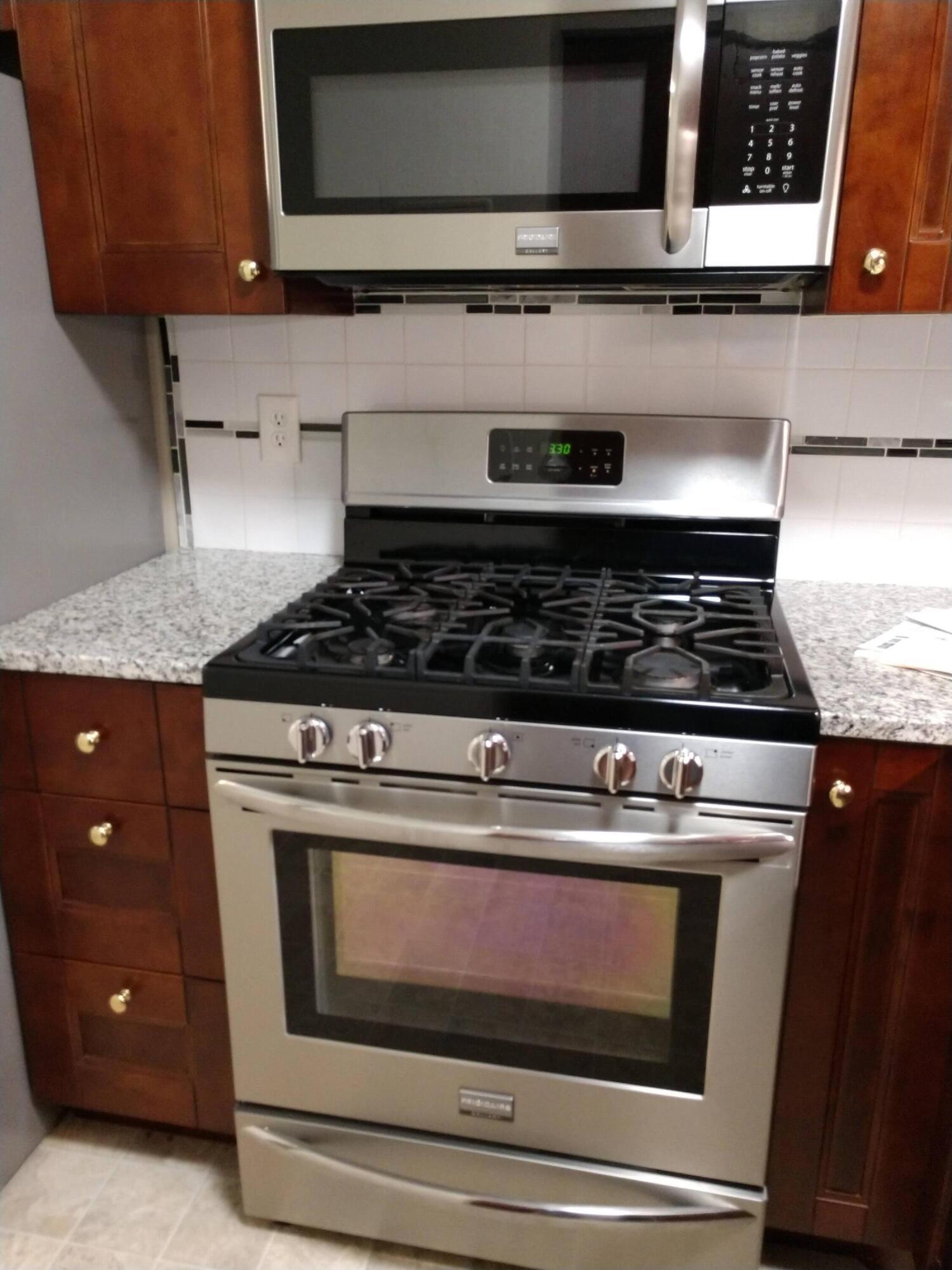 208 West Weber Road Columbus, OH 43202 - Photo 4 of 8 Stainless steel 5 burner gas range plus microwave.