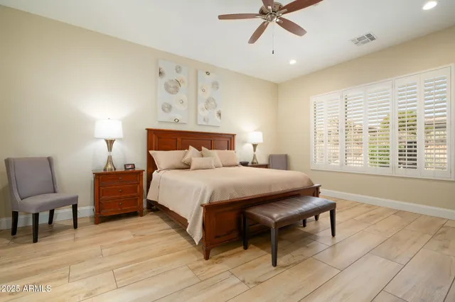 a bedroom with a bed and lamp