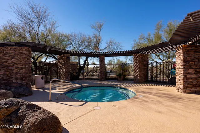 a view of a swimming pool with a patio