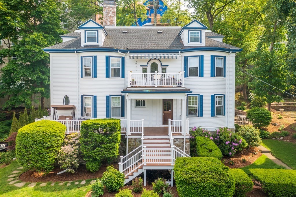 79 University Road, Unit 2 Brookline, MA 02445 - Photo 1 of 35 a front view of a house with a garden