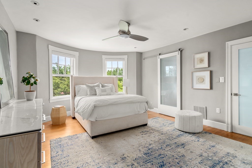 79 University Road, Unit 2 Brookline, MA 02445 - Photo 13 of 35 a spacious bedroom with a bed and a window